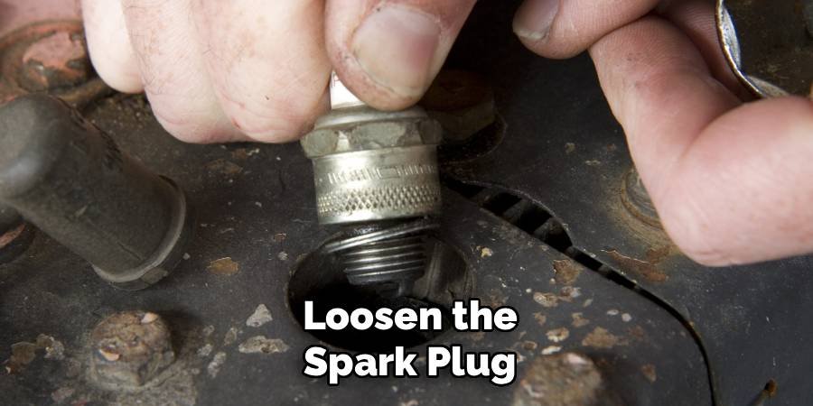 Loosen the Spark Plug