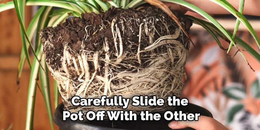 Carefully Slide the
Pot Off With the Other