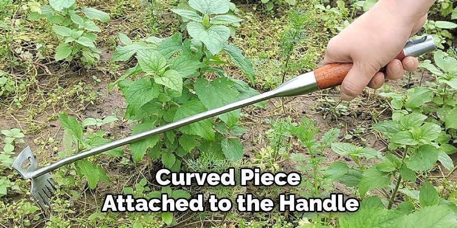 Curved Piece 
Attached to the Handle